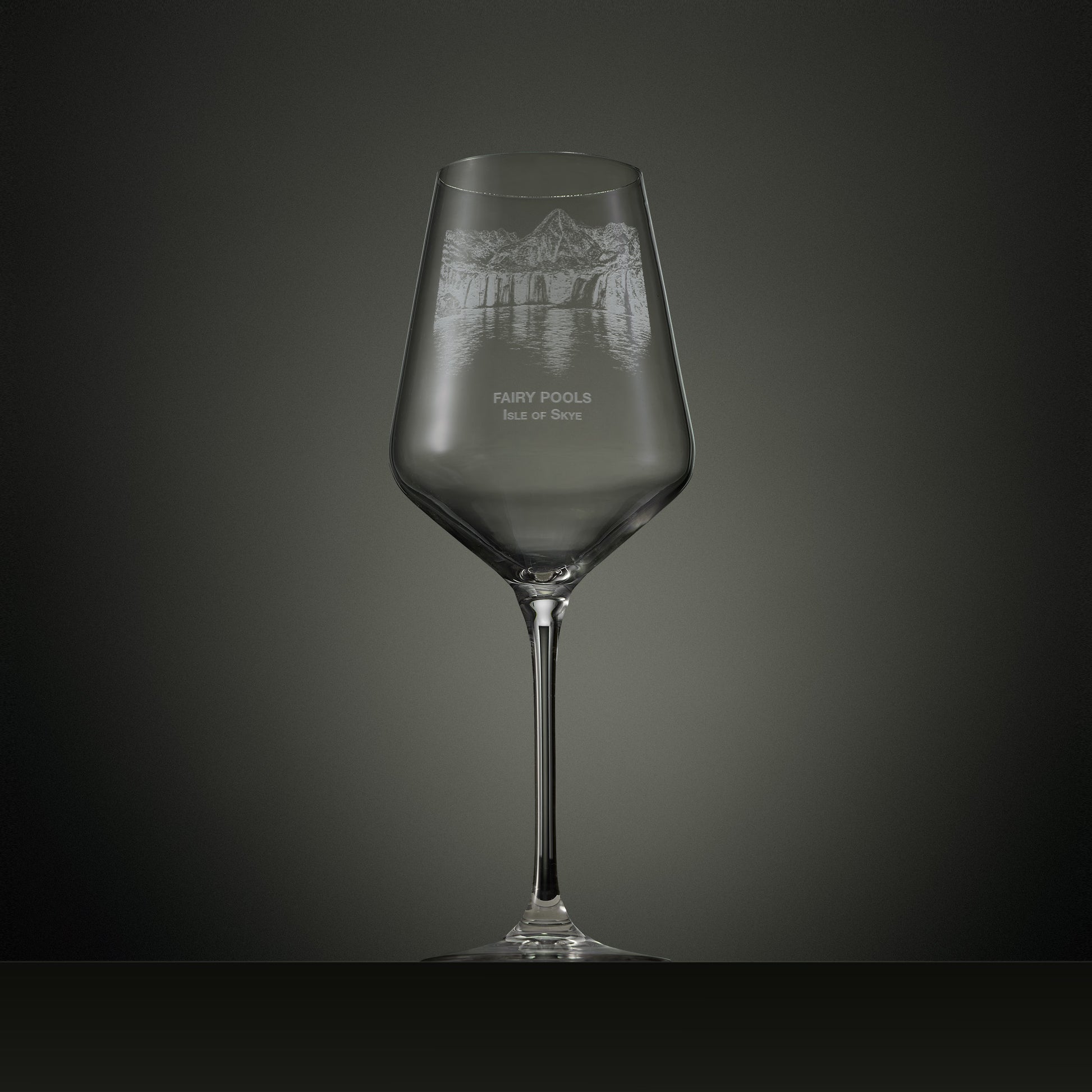 Engraved wine glass featuring the Fairy Pools on the Isle of Skye with cascading waterfalls, reflective pools and the Black Cuillin mountain range.