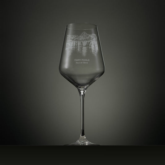 Engraved wine glass featuring the Fairy Pools on the Isle of Skye with cascading waterfalls, reflective pools and the Black Cuillin mountain range.