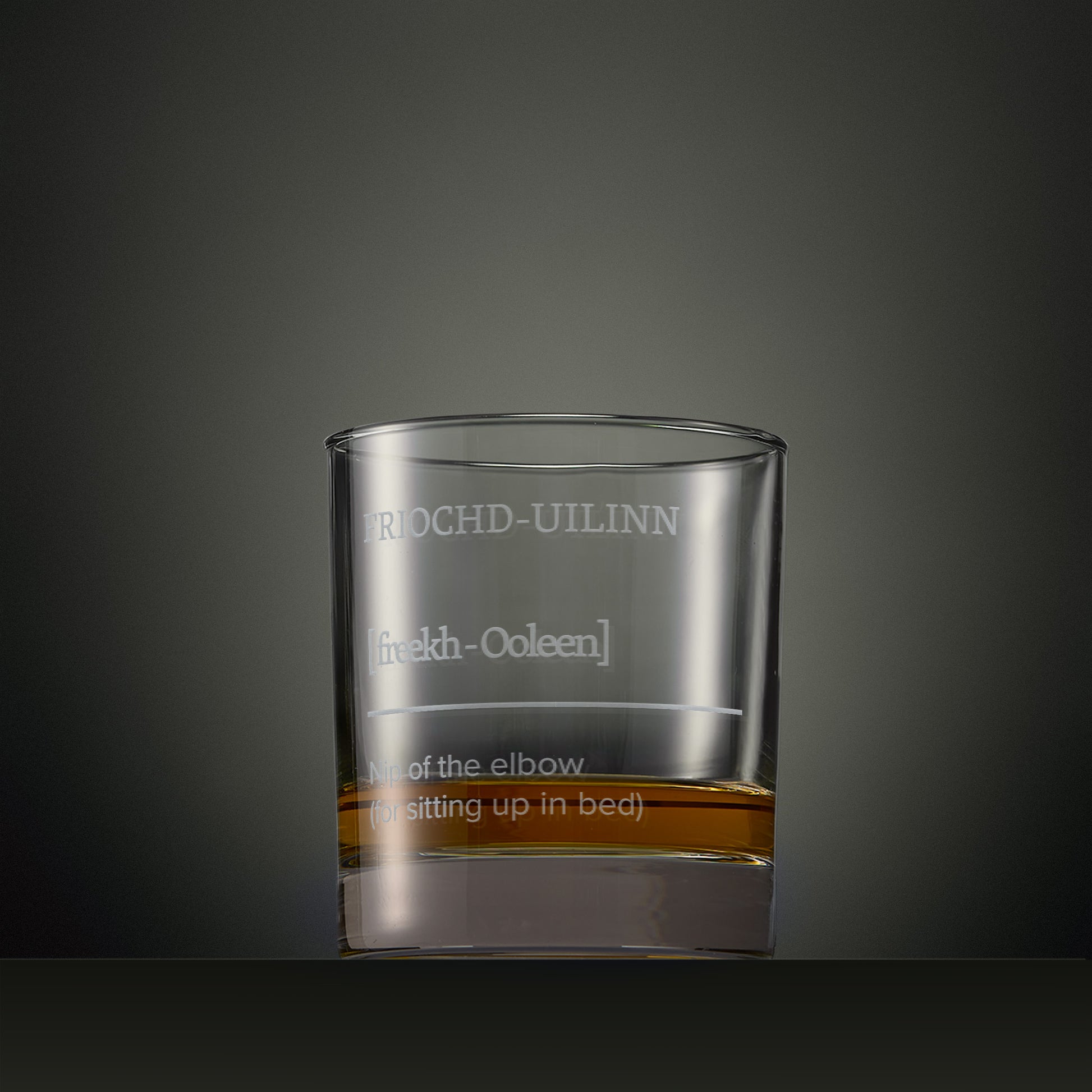 One of the Four Morning Drams engraved whisky glasses featuring Scottish Gaelic typography and explanatory text.
