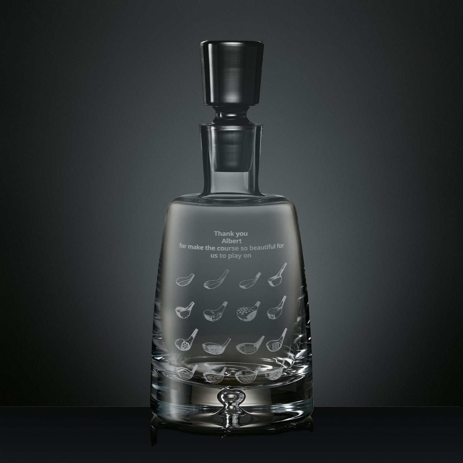 Engraved crystal decanter featuring illustrations of golf clubs and personalised with an inscription