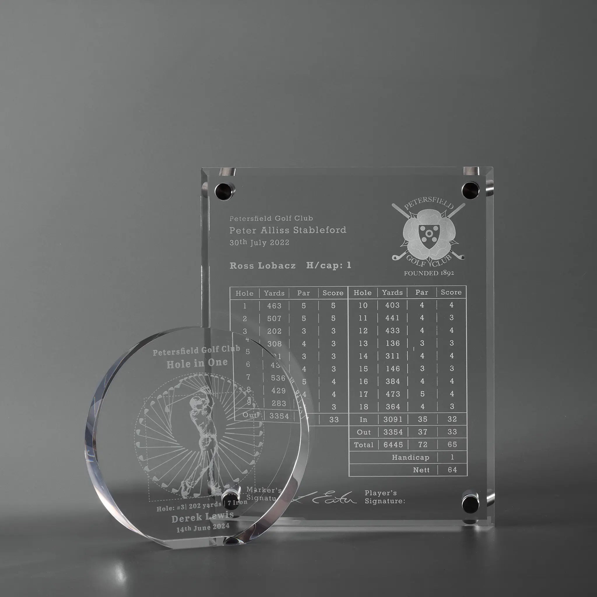Two personalised golf presentation awards engraved with hole in one details  and a course record scorecard with club logo and signatures