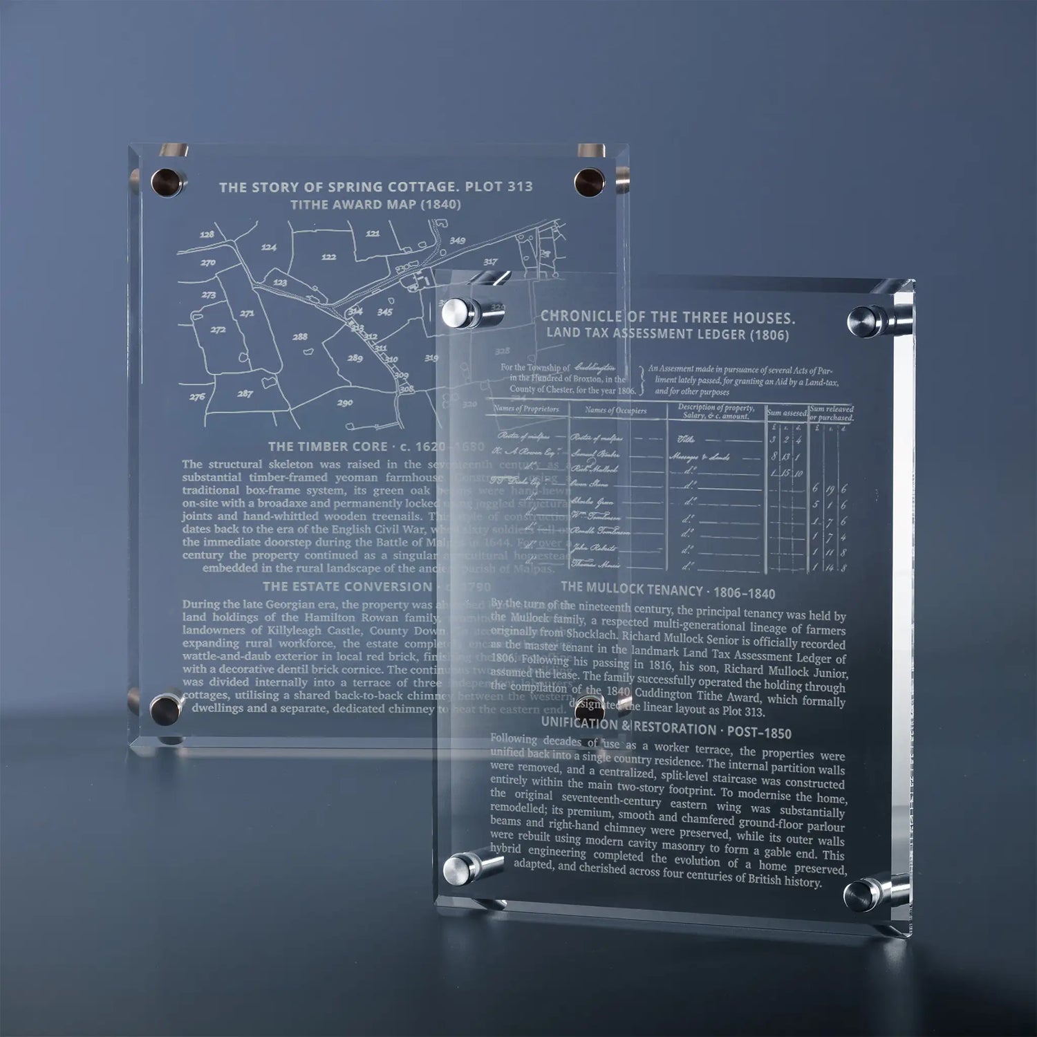 Two clear glass wall plaques with silver metal stand-offs and mounting hardware, Each plaque is engraved with historic maps, tithe ledgers and supporting paragraph information.