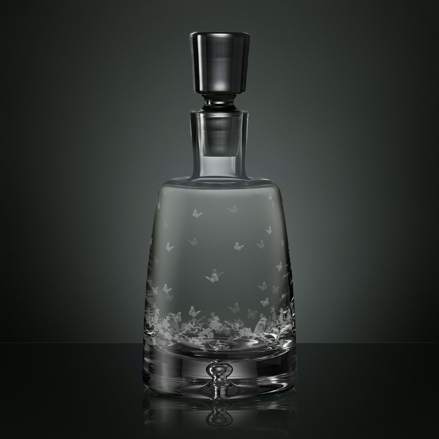 Engraved spirit decanter featuring garden birds, butterflies and blossom