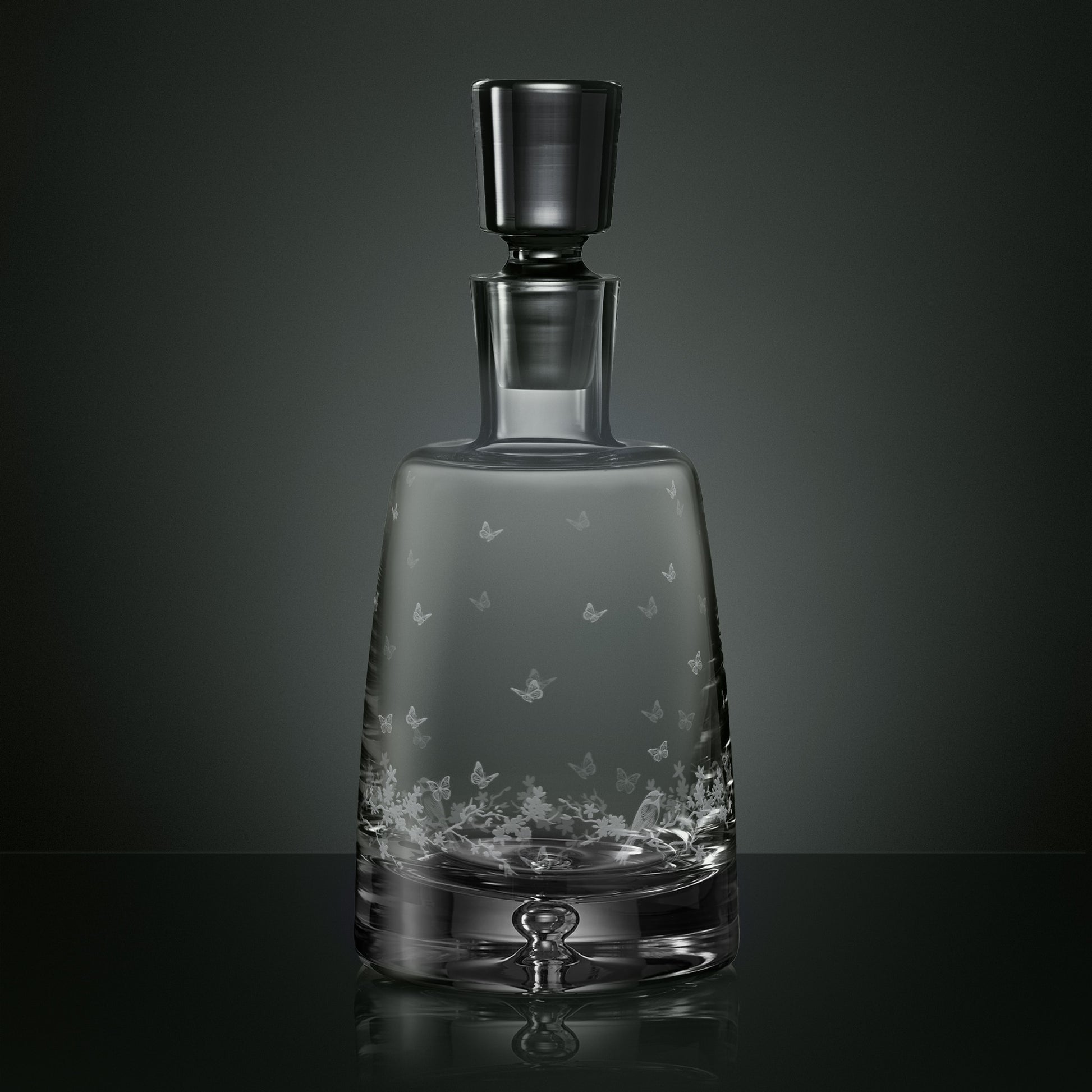 Engraved spirit decanter featuring garden birds, butterflies and blossom