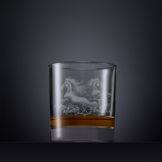 Engraved wine glass with an  illustration of two horses galloping through the water
