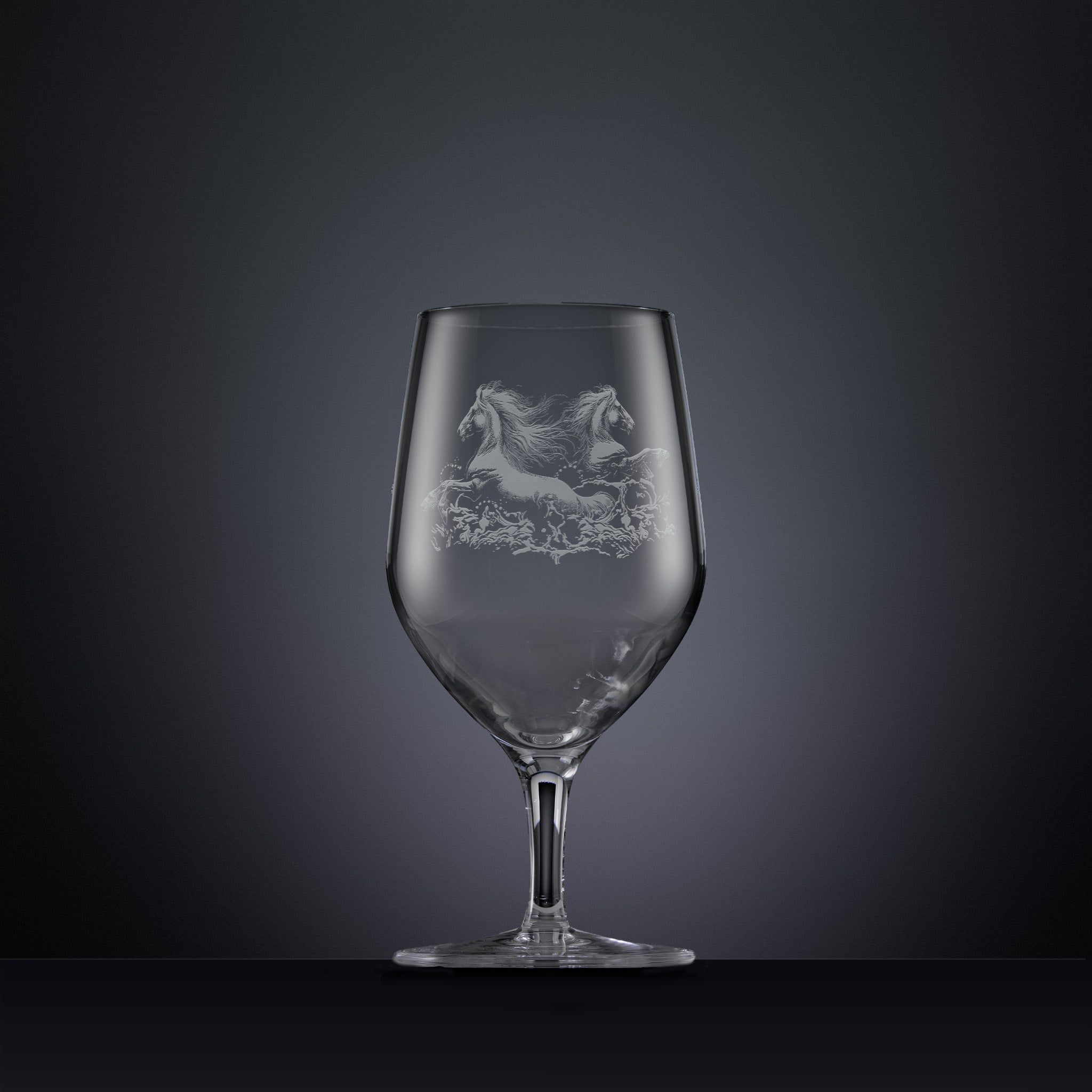 Engraved wine glass with an  illustration of two horses galloping through the water