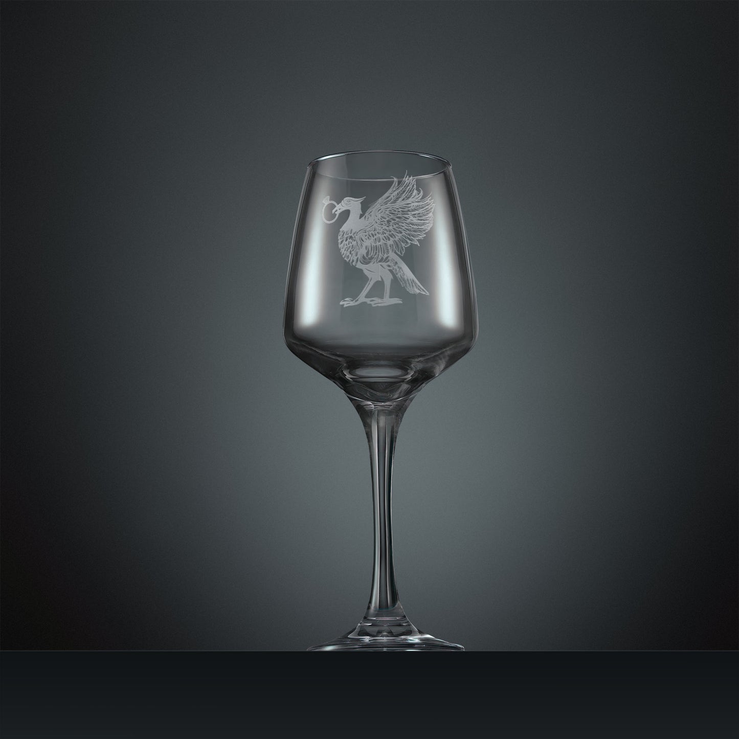 Engraved wine glass featuring a Liver Bird with an engagement ring in its beak