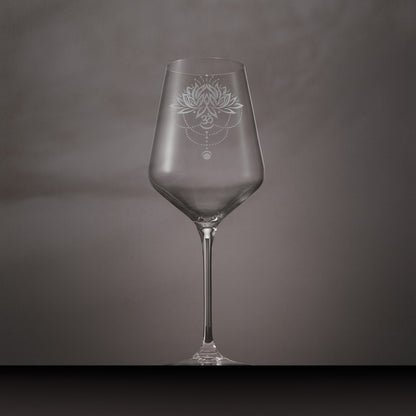 Wine glass engraved with lotus flower, water droplets om and lunar phase symbols