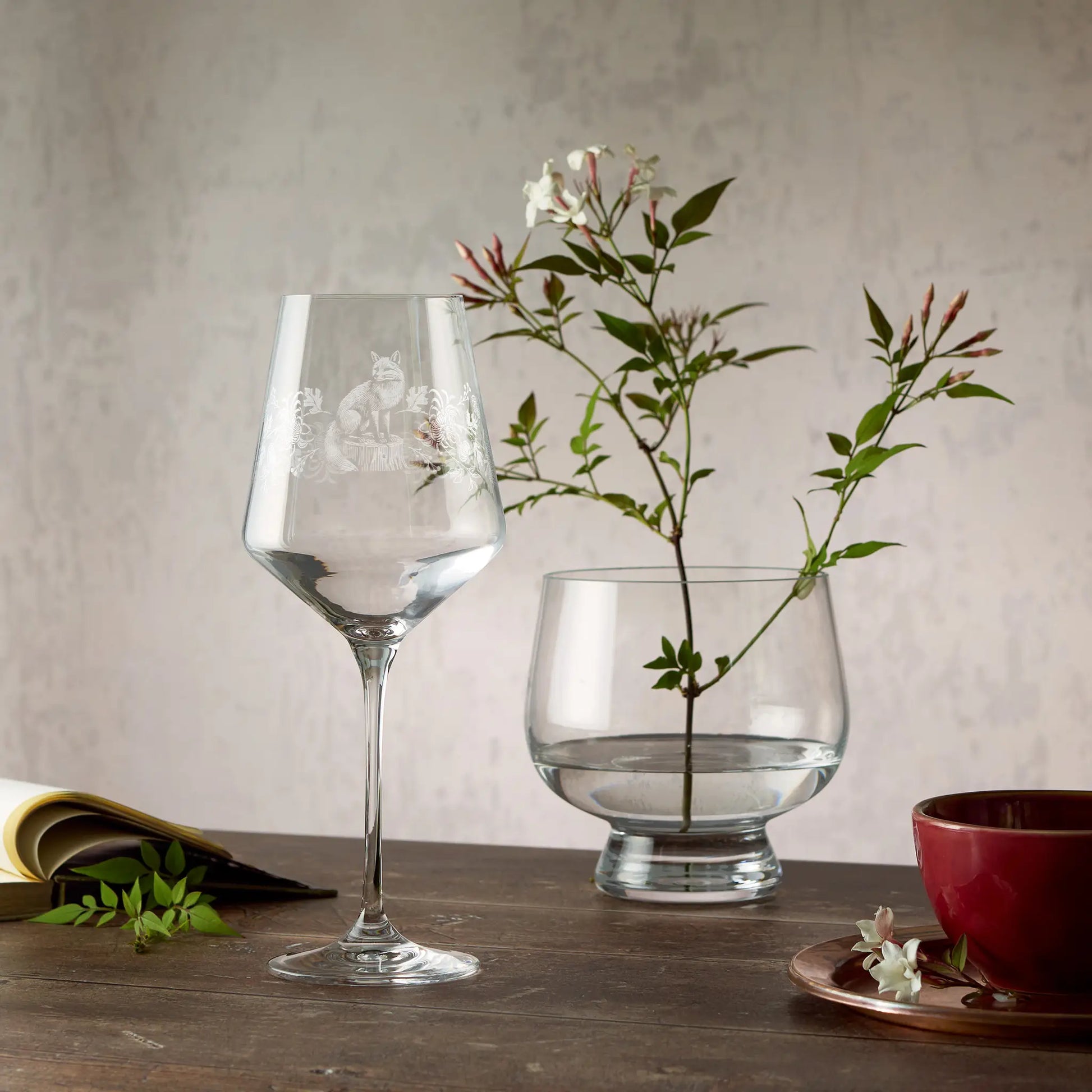 Engraved wine glass featuring Chrysanthemums, Peonies and a Fox in a wraparound design