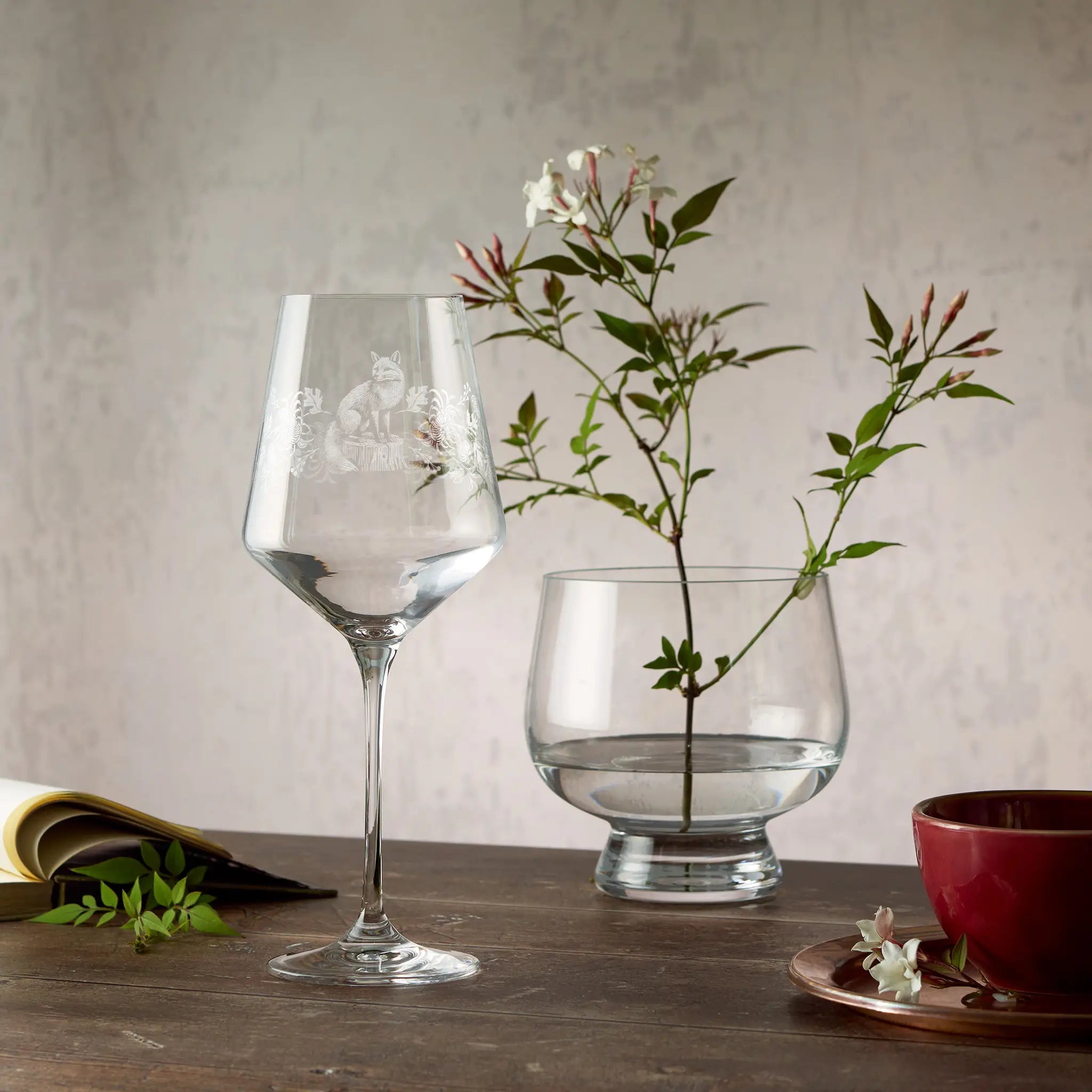 Engraved wine glass featuring Chrysanthemums, Peonies and a Fox in a wraparound design