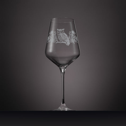 Engraved wine glass featuring marigolds, cosmos and a tawny owl