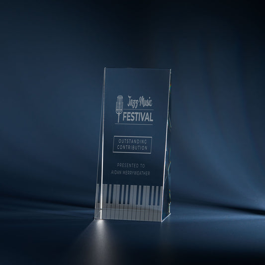 Engraved optical crystal wedge award with music-themed design and personalised inscription