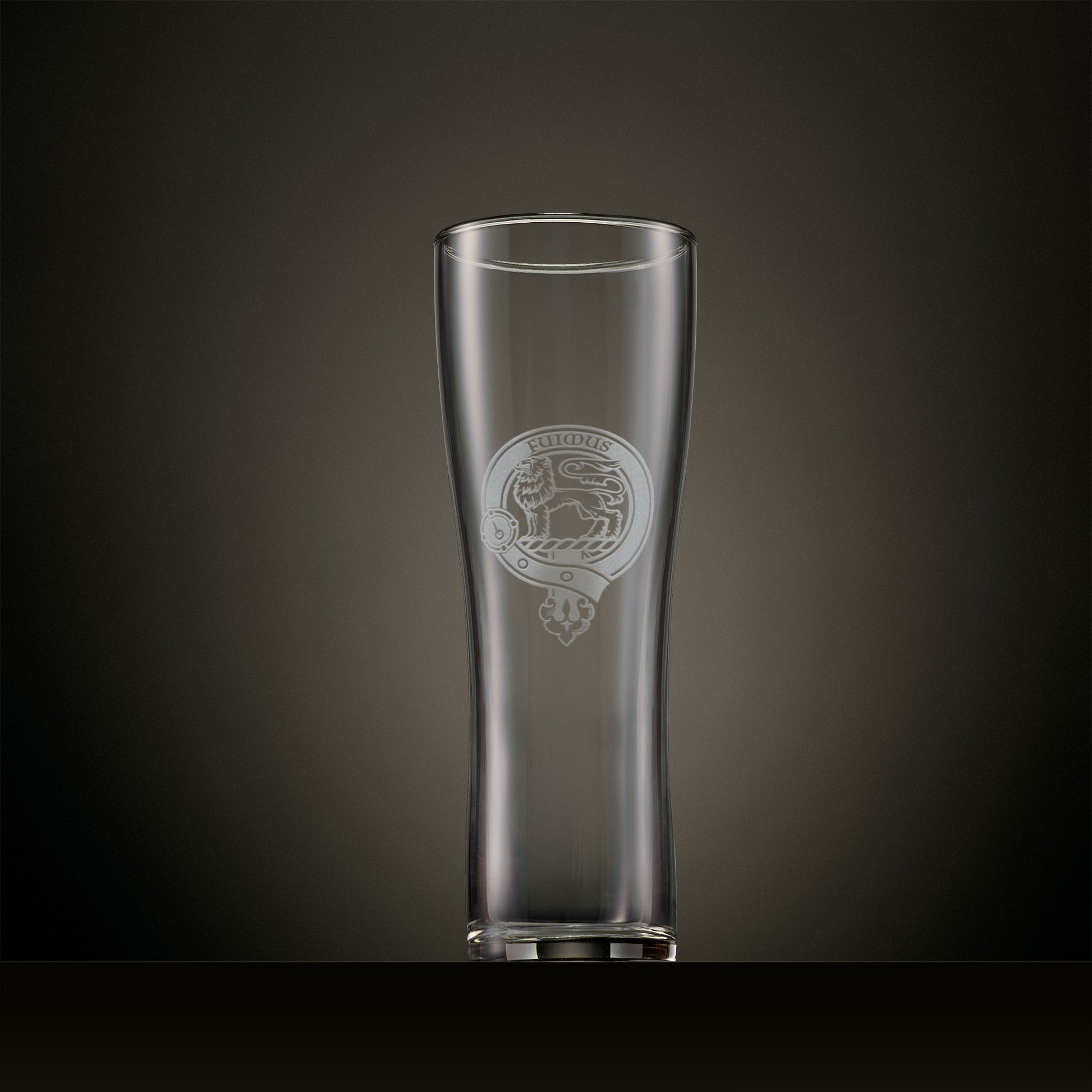 Engraved pint glass featuring a personalised Scottish clan crest with buckle and belt design