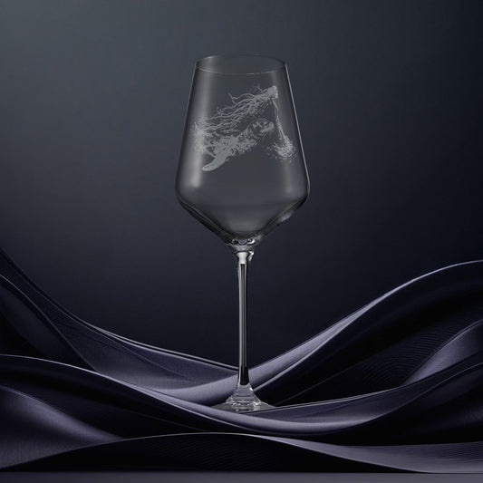 Engraved wine glass with an  illustration of a selkie and a seal, mythological in Gaelic folklore