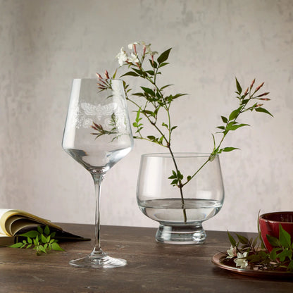 Engraved wine glass featuring morning glory, asters and a moth in a wraparound composition