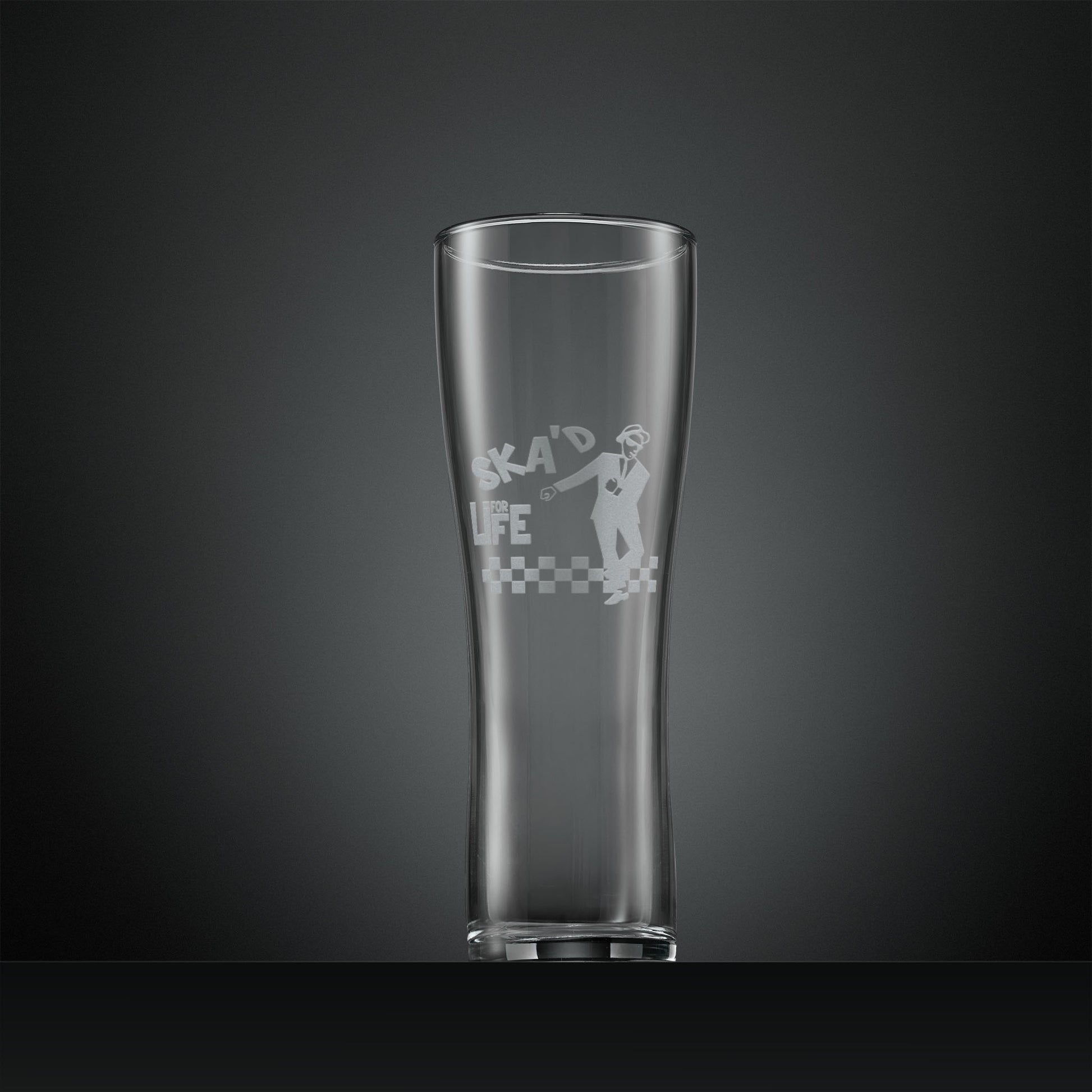 Engraved pint glass featuring a a dancing Ska man and the words SKA'd for life