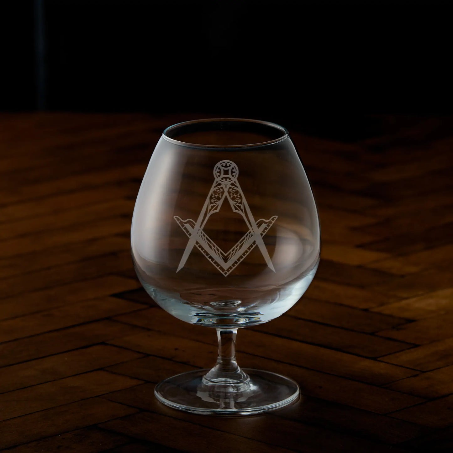 Engraved brandy glass with Masonic square and compass design