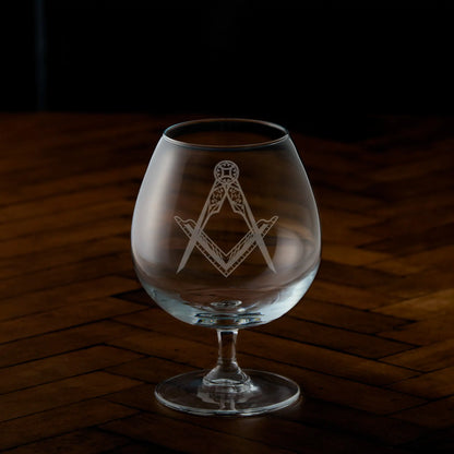 Engraved brandy glass with Masonic square and compass design