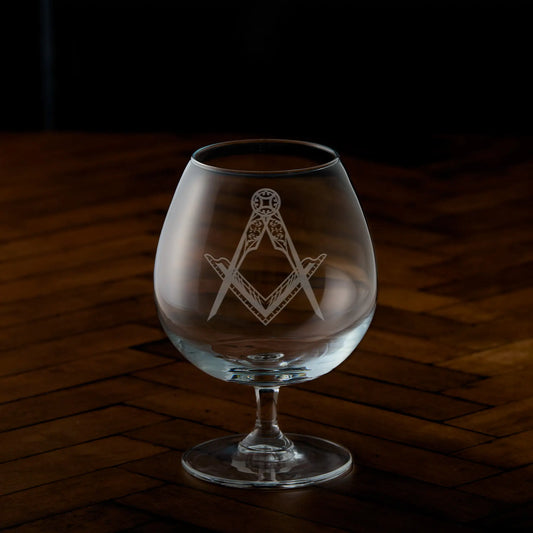 Engraved brandy glass with Masonic square and compass design