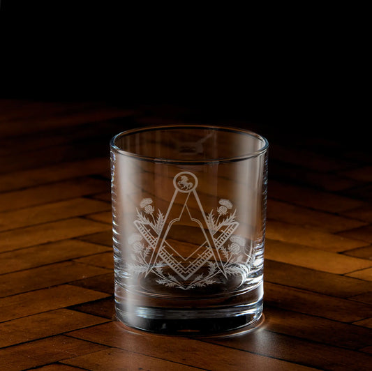 Engraved Masonic whisky glass with Square & Compass, thistles, and unicorn design