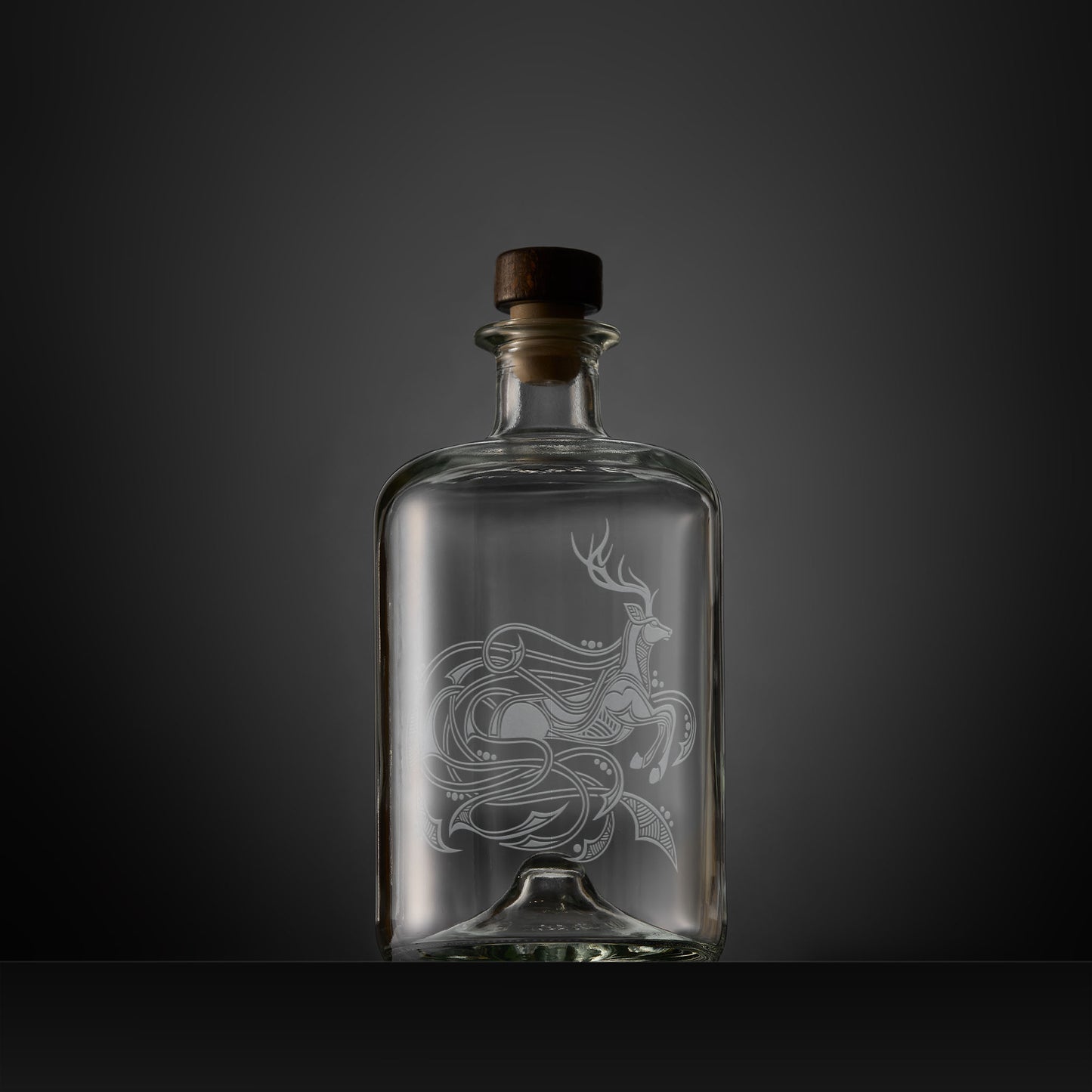 Celtic Knotwork decanter engraved with a stag, circles and flowing anamorphic design