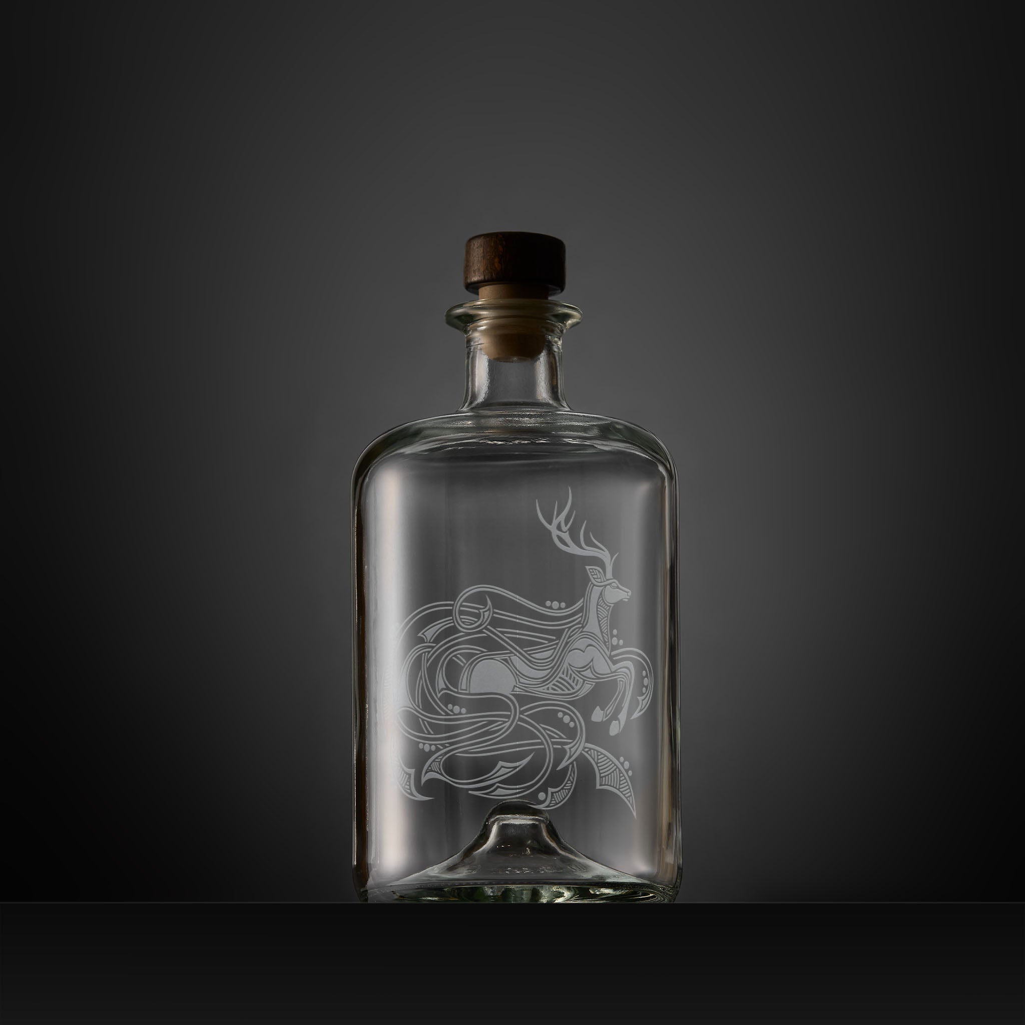 Celtic Knotwork decanter engraved with a stag, circles and flowing anamorphic design