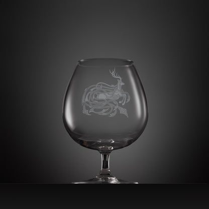 Engraved brandy glass with an  illustration of a stag entwined with Celtic knotwork
