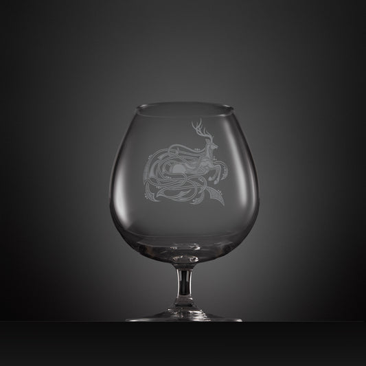Engraved brandy glass with an  illustration of a stag entwined with Celtic knotwork