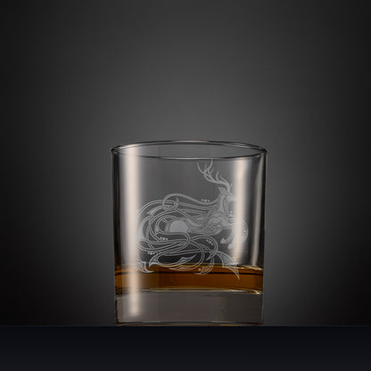 Engraved whisky glass with an  illustration of a stag with flowing Celtic knotwork