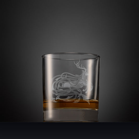 Engraved whisky glass with an  illustration of a stag with flowing Celtic knotwork