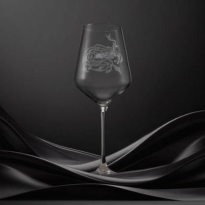 Engraved wine glass with an  illustration of a stag with flowing Celtic knotwork