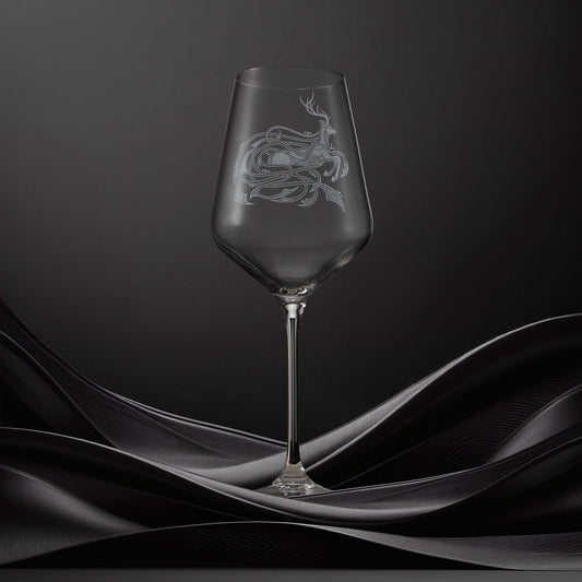 Engraved wine glass with an  illustration of a stag with flowing Celtic knotwork