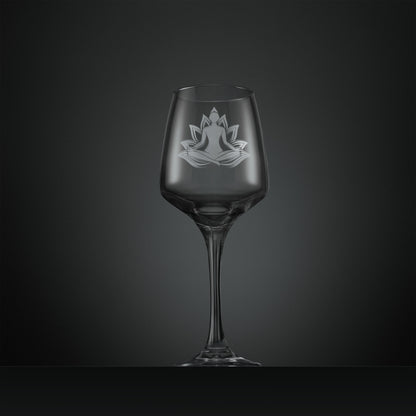 Clear wine glass with a engraved yoga design