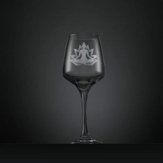 Clear wine glass with a engraved yoga design