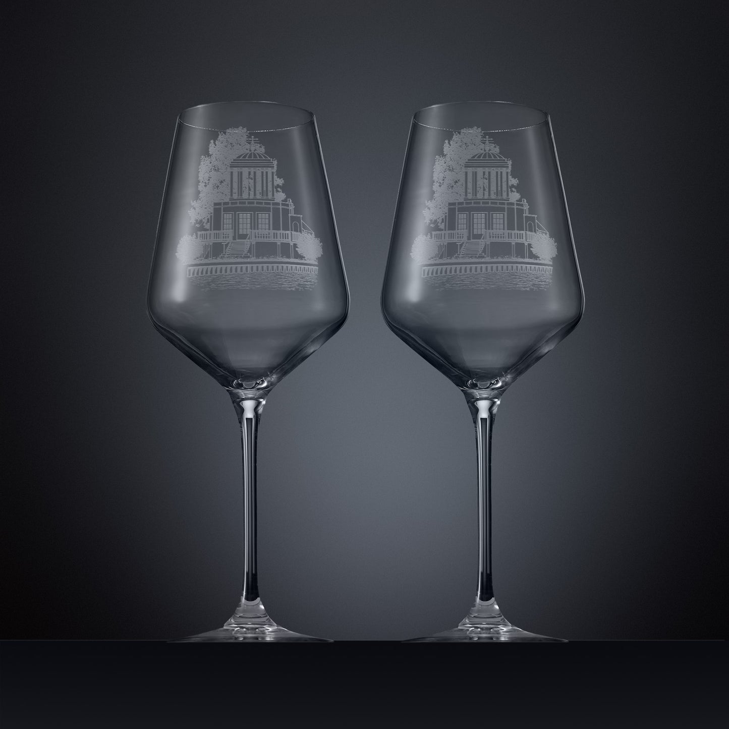 Two engraved wine glasses featuring an illustration of Temple Island, Henley-on-Thames 