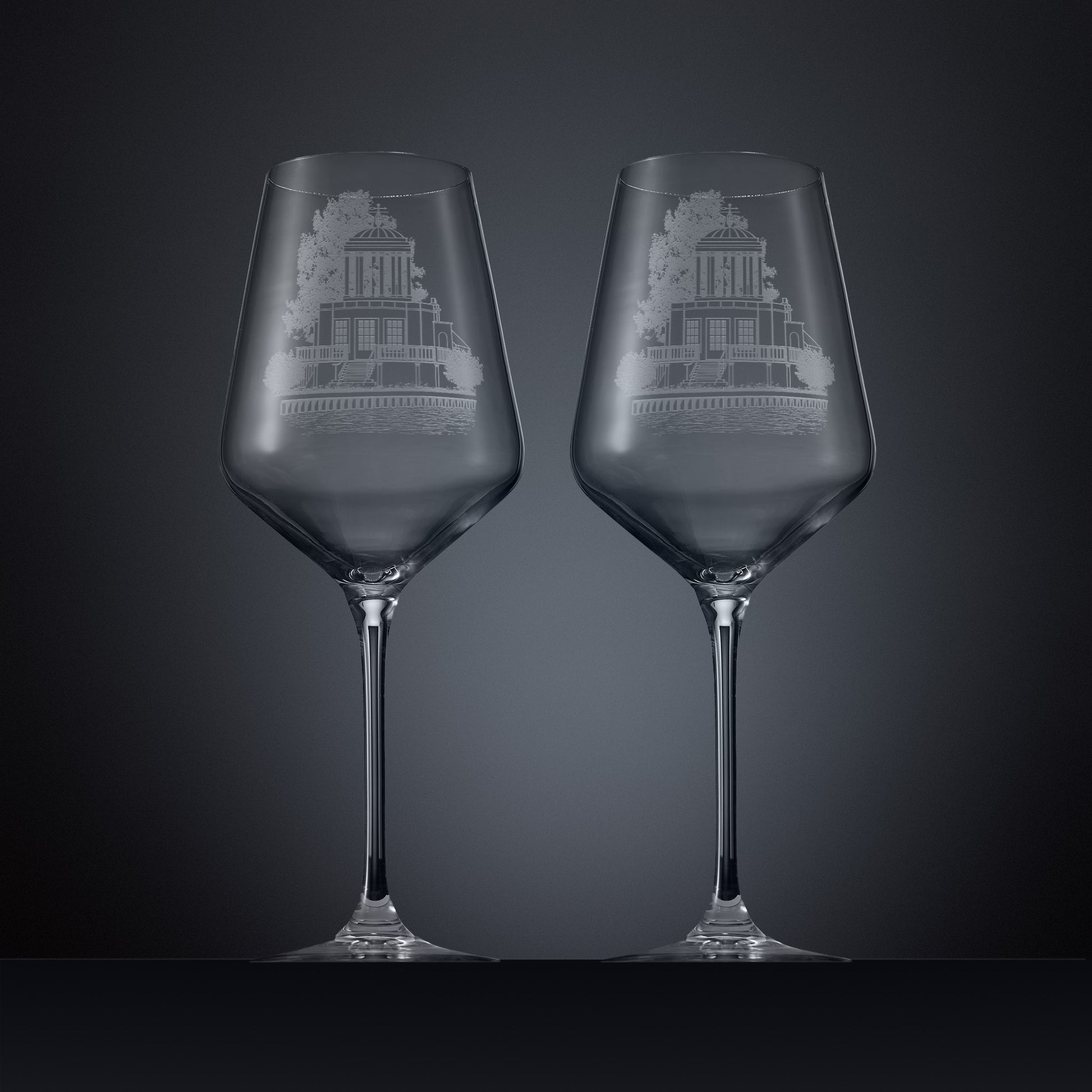 Two engraved wine glasses featuring an illustration of Temple Island, Henley-on-Thames 