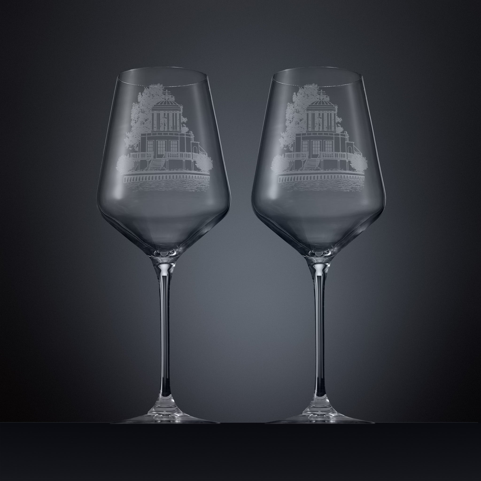Two engraved wine glasses featuring an illustration of Temple Island, Henley-on-Thames 