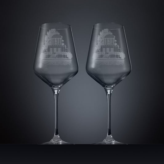 Two engraved wine glasses featuring an illustration of Temple Island, Henley-on-Thames 