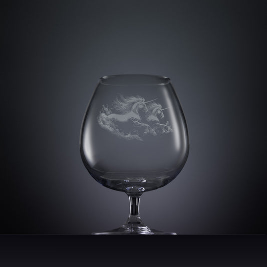 Engraved brandy glass with an  illustration of two unicorns galloping through the water