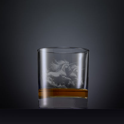 Engraved whisky glass with an  illustration of two unicorns galloping through clouds