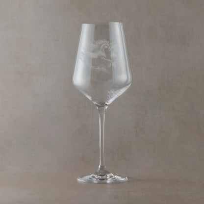 Engraved wine glass with an  illustration of two unicorns galloping 