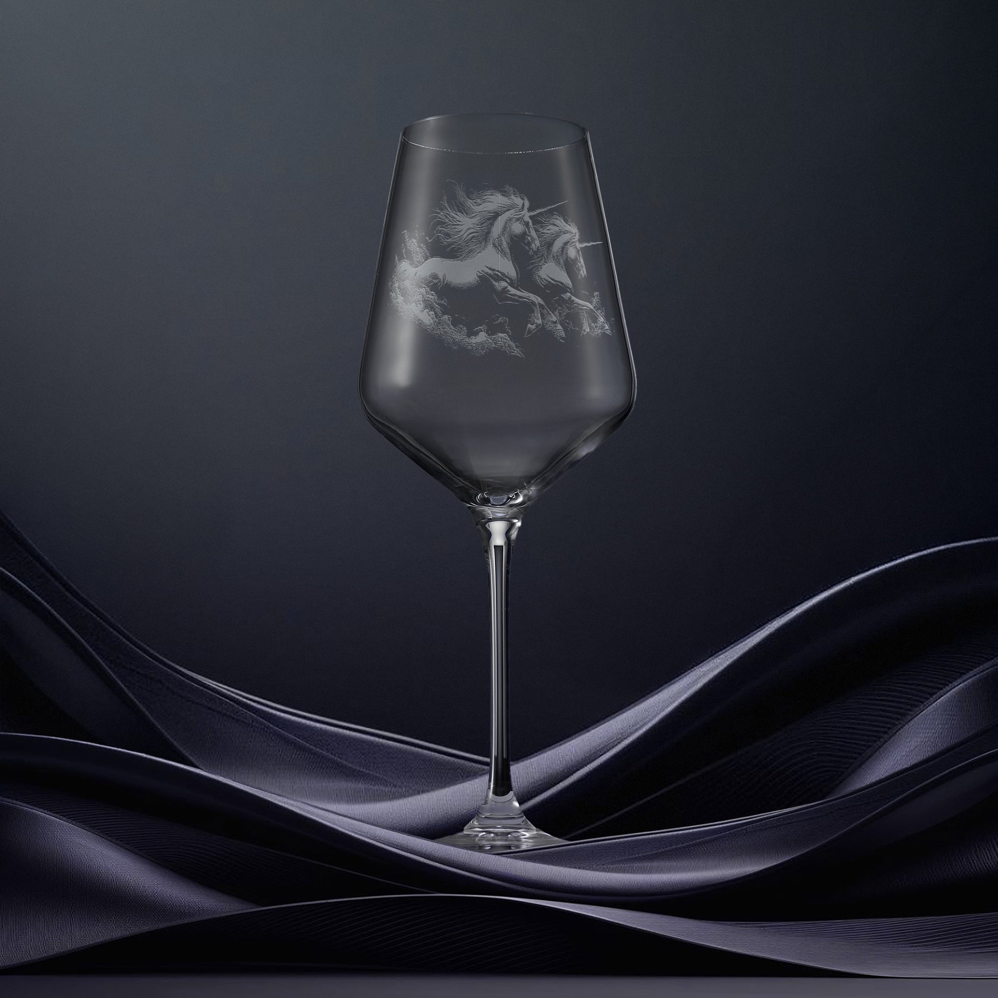 Engraved wine glass with an  illustration of two unicorns galloping through the water