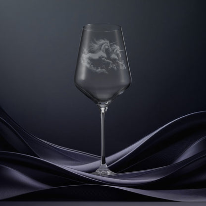 Engraved wine glass with an  illustration of two unicorns galloping through the water