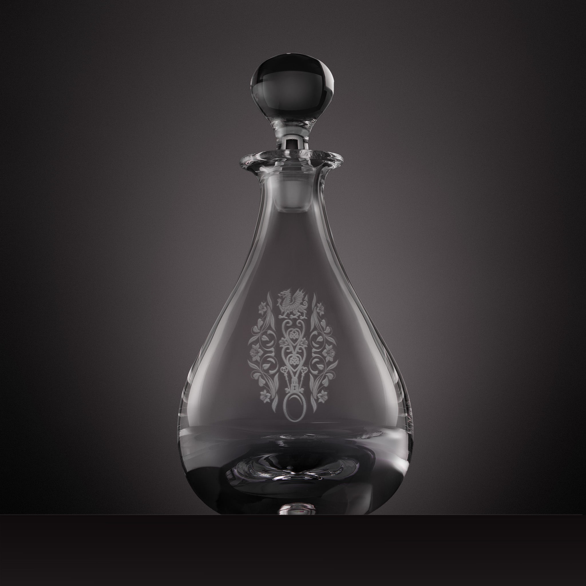 Engraved Welsh lovespoon design featuring the Welsh dragon, entwined hearts, crossed keys and daffodil motifs