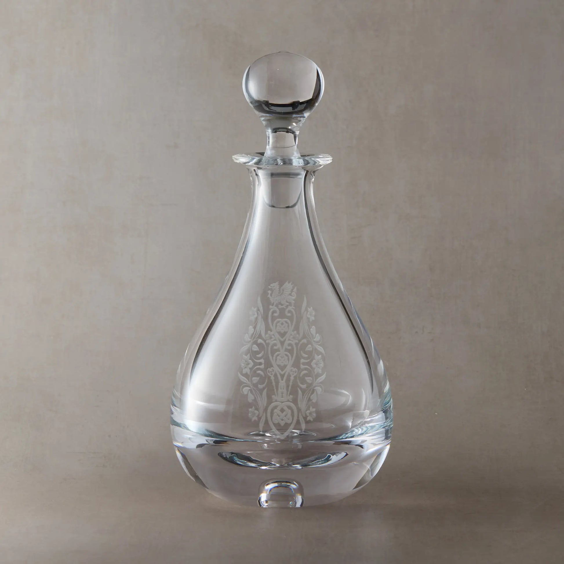 Wine decanter engraved with Welsh dragon, knotwork hearts, crossed keys and daffodil motifs