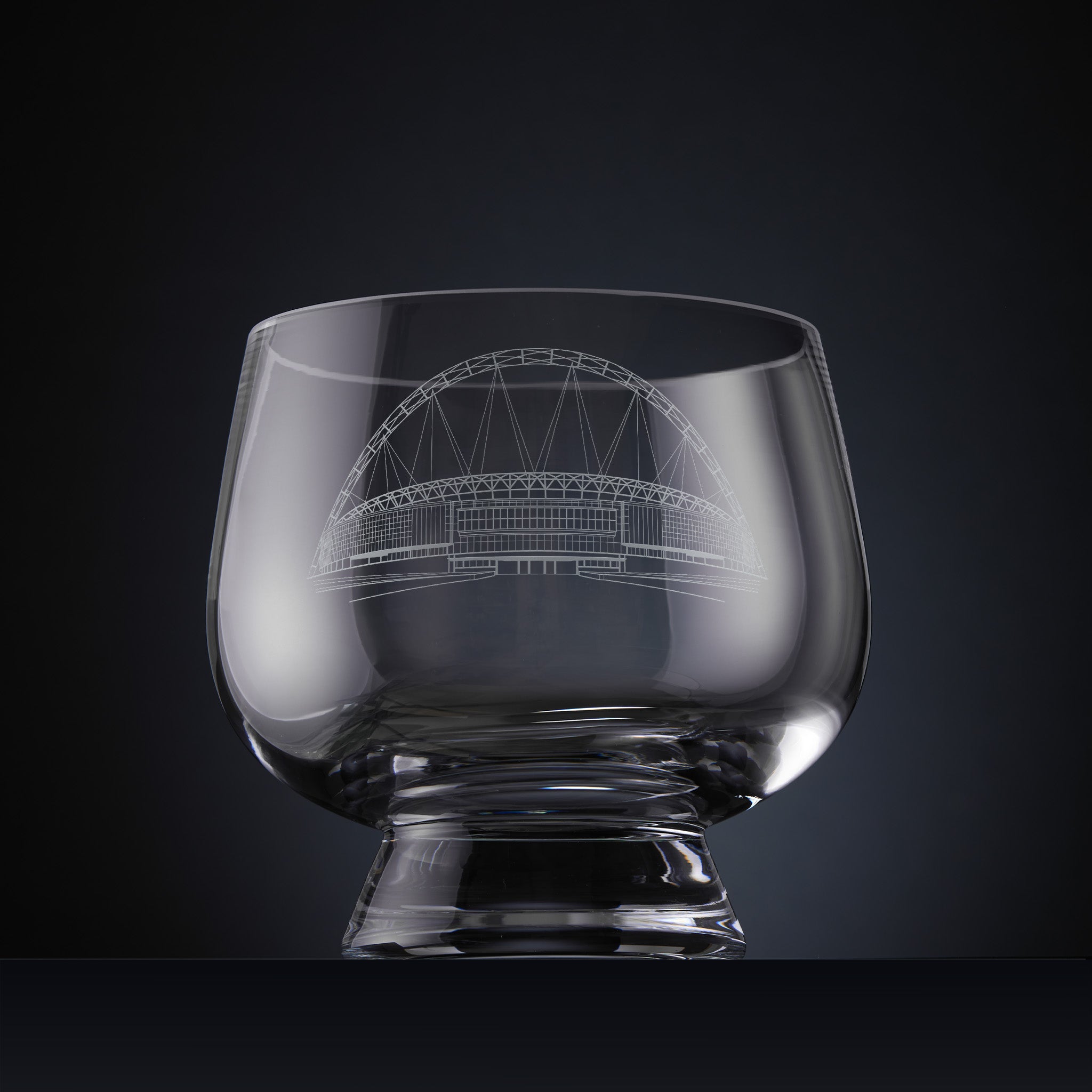 Clear glass bowl with engraved architectural illustration of Wembley Stadium.
