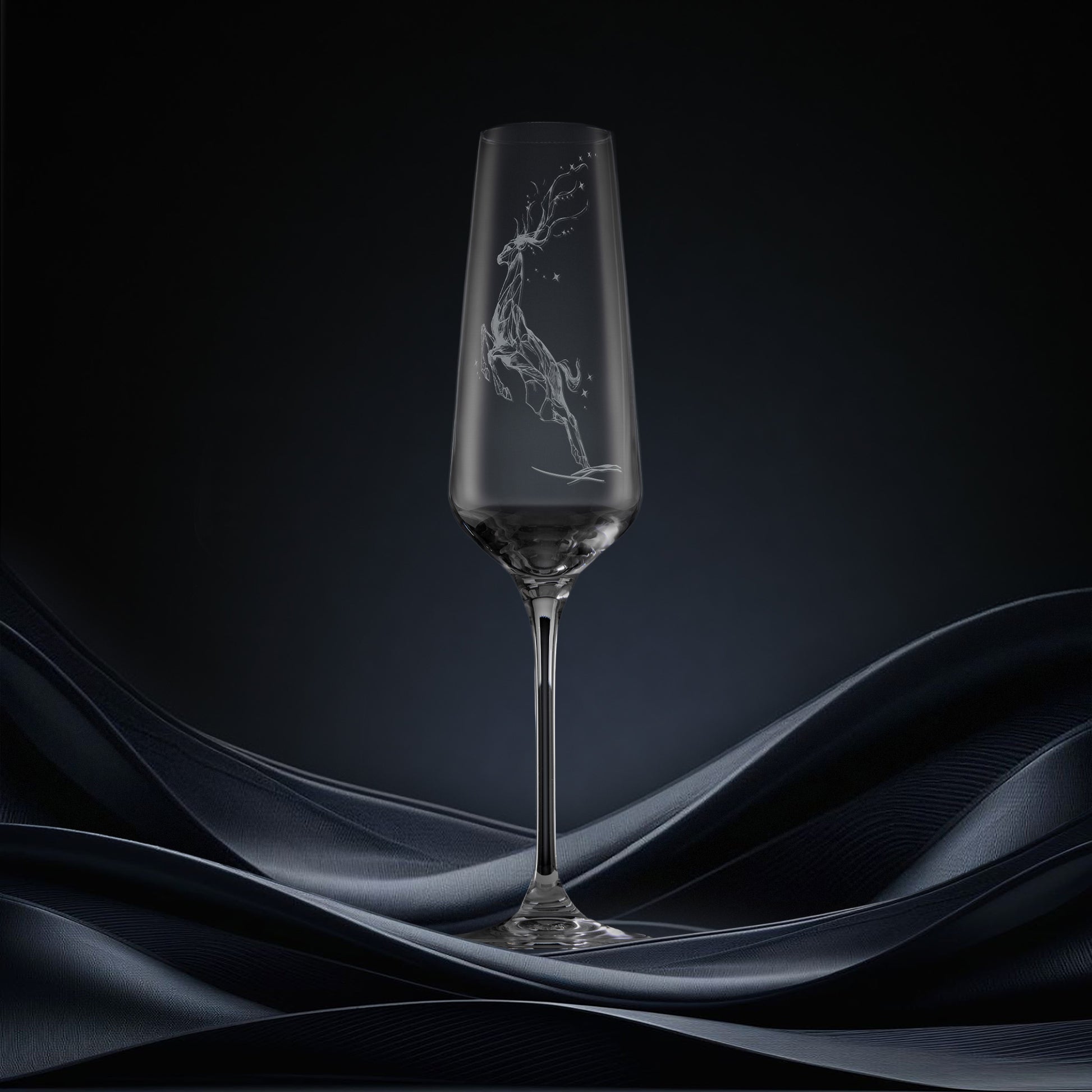 Engraved champagne flute featuring a leaping stag forming a constellation of stars