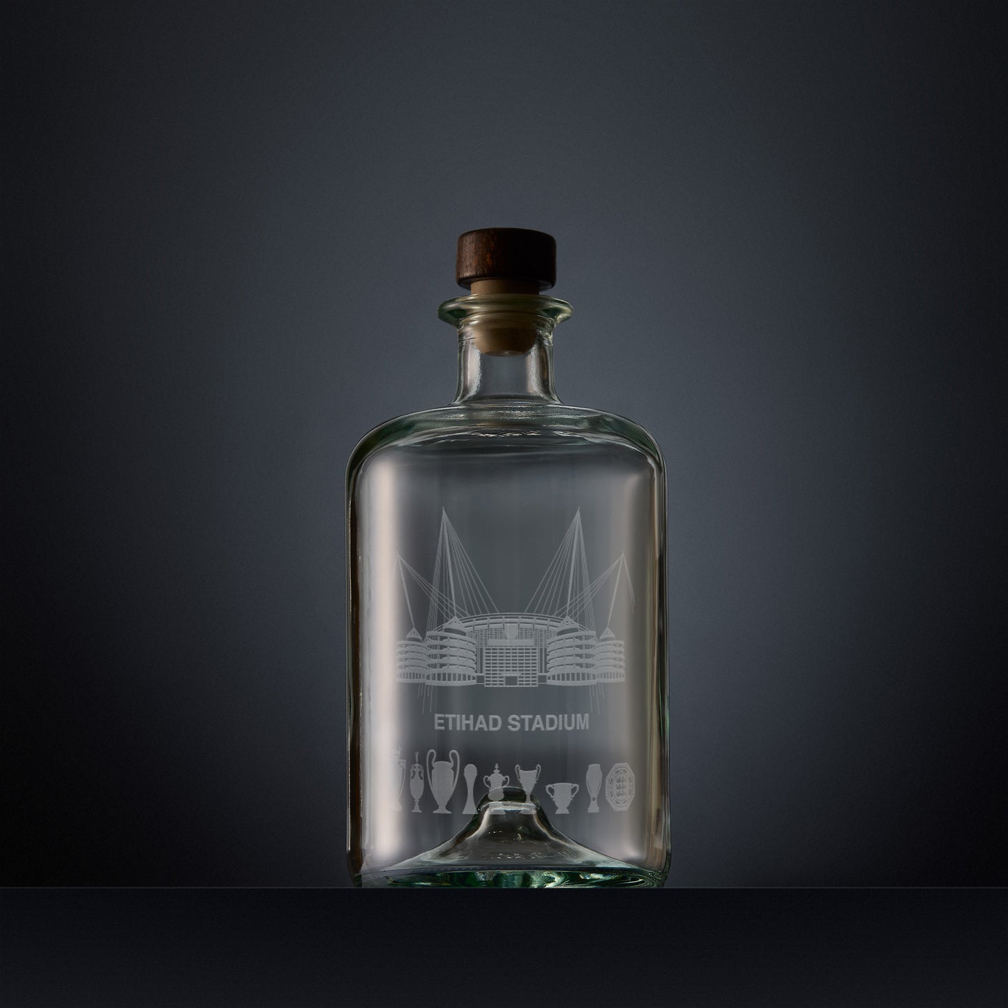 Engraved apothecary-style decanter with Etihad stadium and trophies illustration 