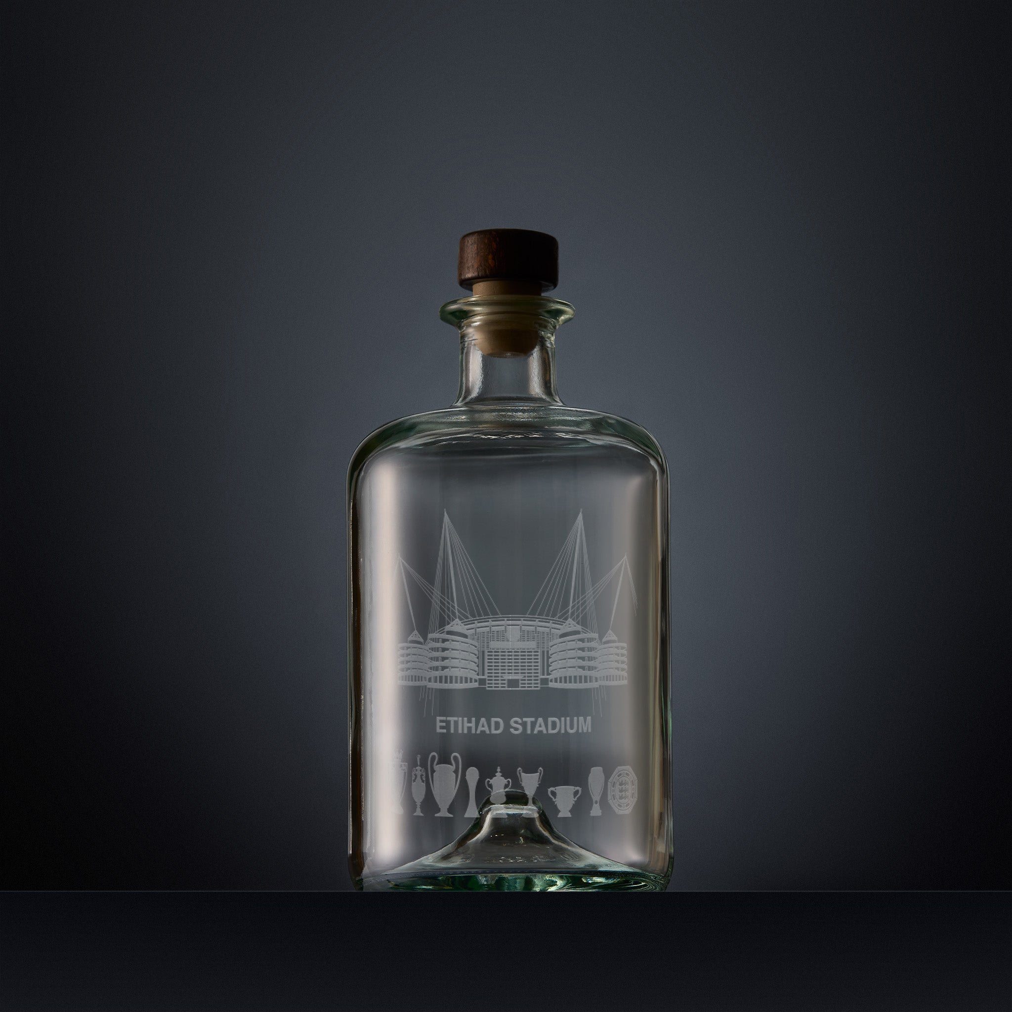 Engraved apothecary-style decanter with Etihad stadium and trophies illustration 