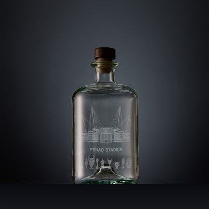 Engraved apothecary-style decanter with Etihad stadium and trophies illustration 